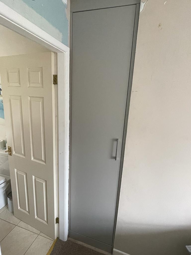 Fitted bedroom furniture with fitted wardrobes in North Stainley, Harrogate Features flush modern style door finished in Matt dove grey, walnut effect interiors with integrated lighting5