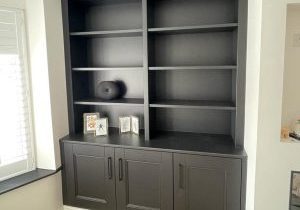 Traditional style bespoke alcove units in Harrogate finished in satin charcoal. Features - beaded shaker style doors, fixed shelving Cornice section
